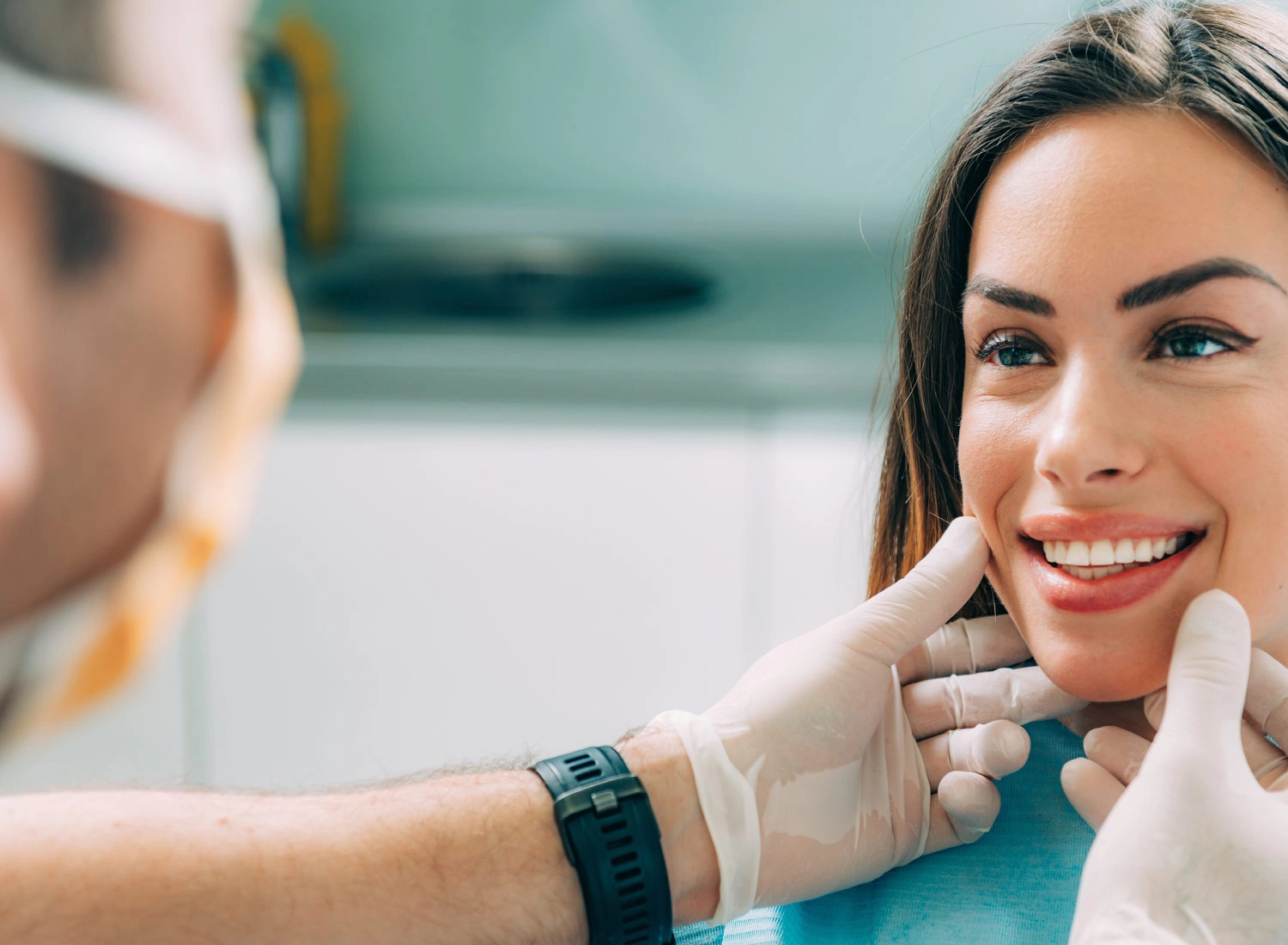  dentist with patient examine teeth