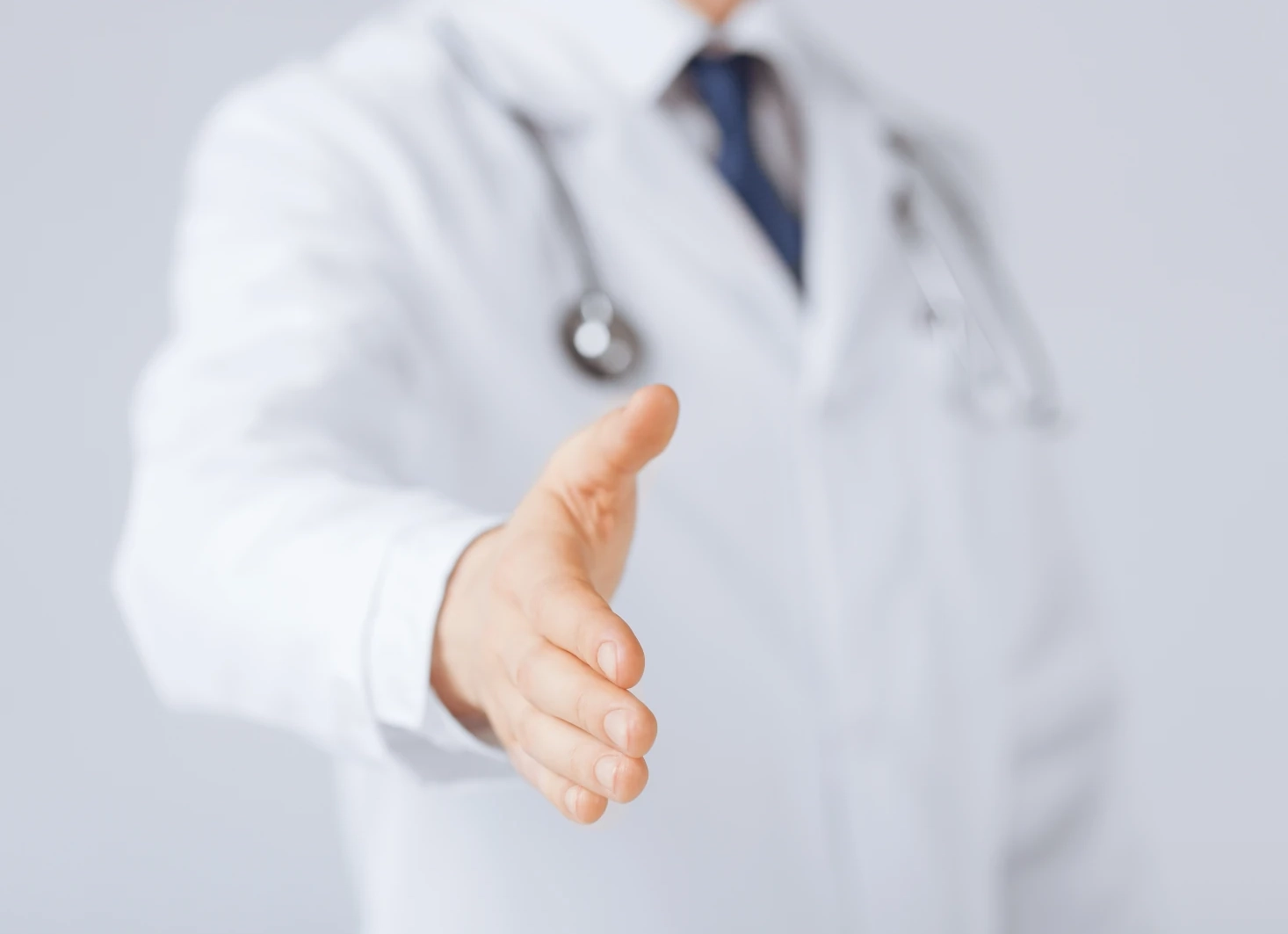 doctor holding out hand for a shake