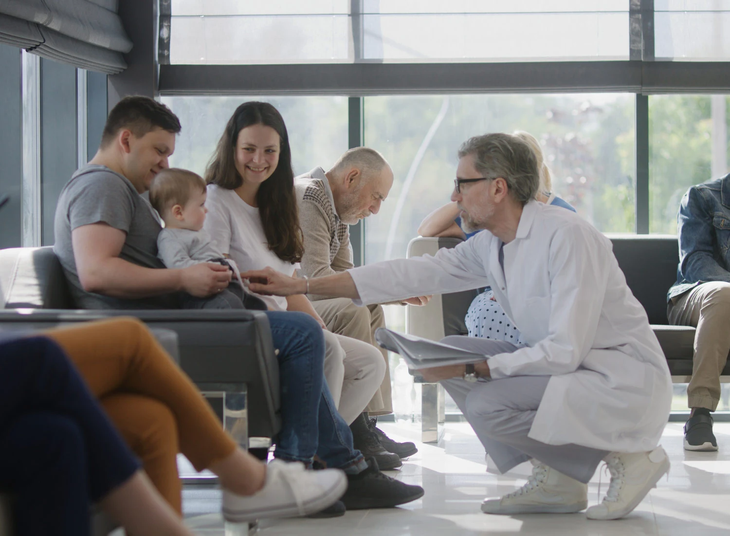doctor in waiting room with patients