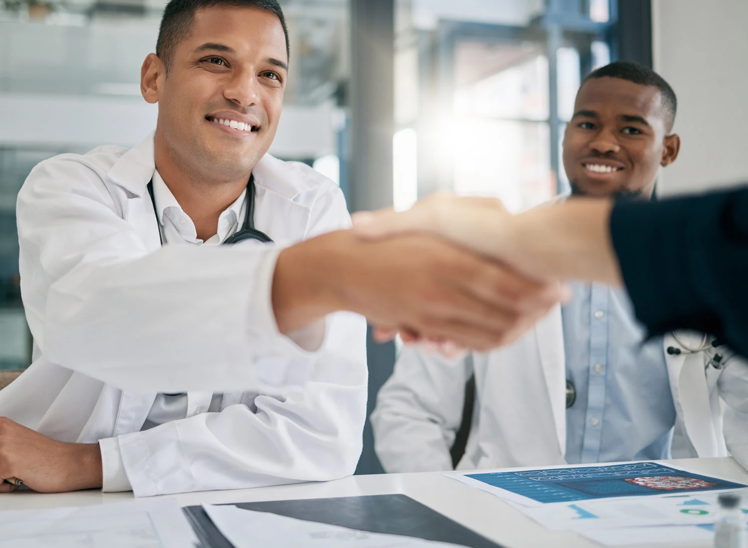 doctor shaking hand with consultant