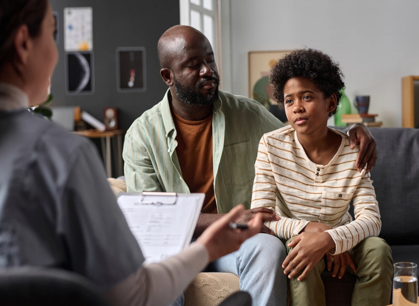 doctor with child and father