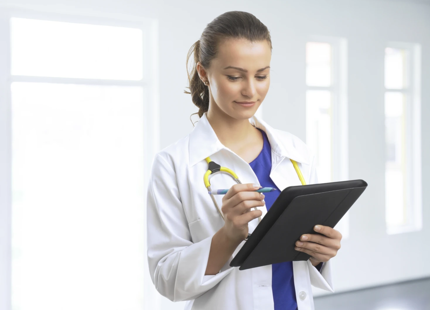 nurse practitioner with tablet