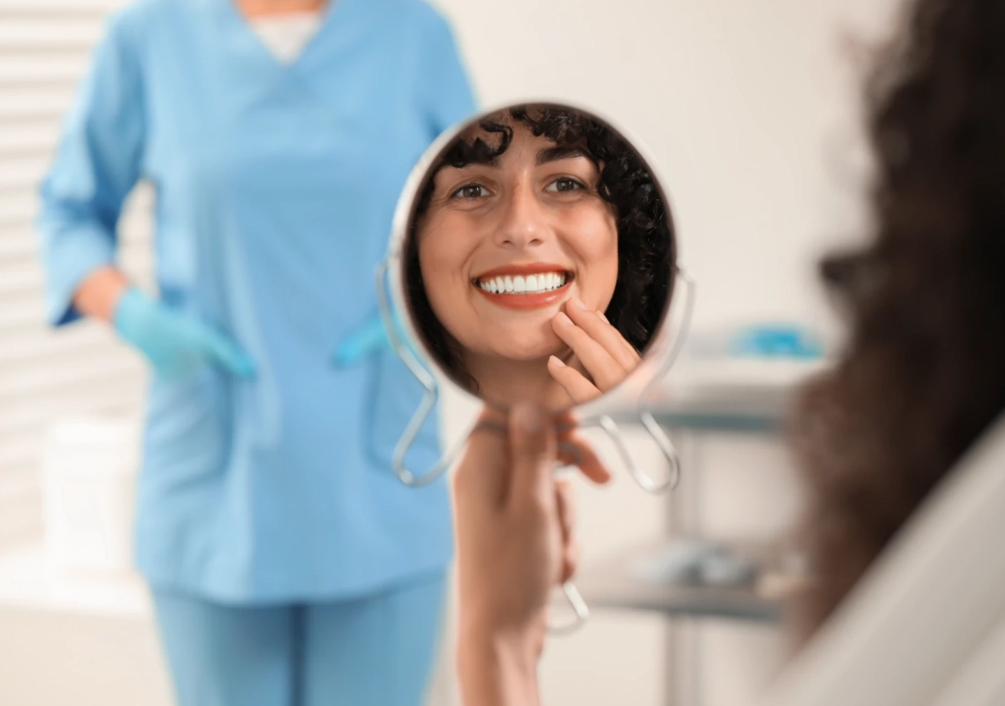 patient smiling with dentist