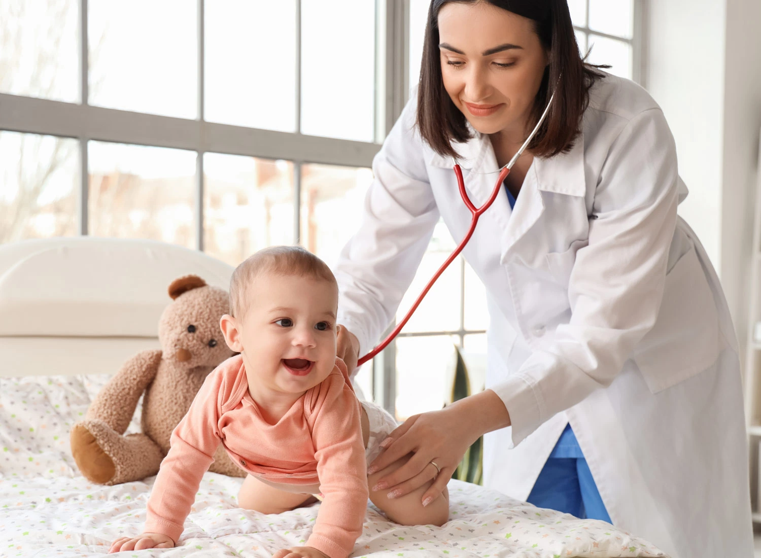 pediatrician with stethoscope and baby