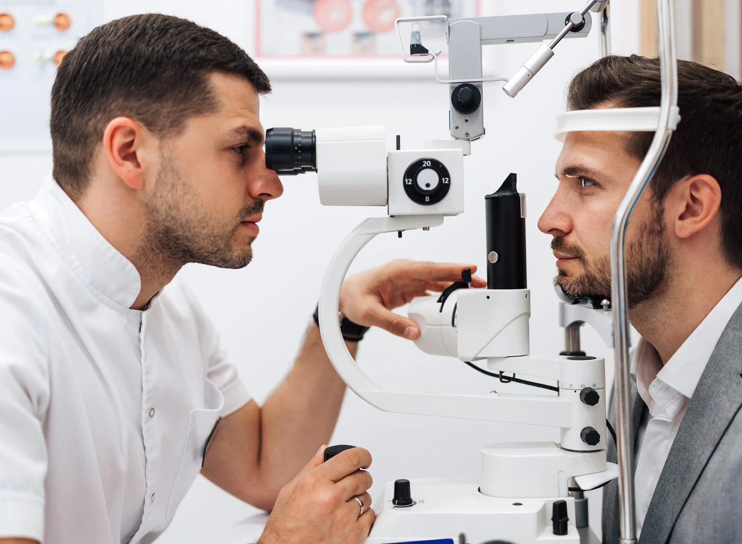 doctor testing eyes with equipment