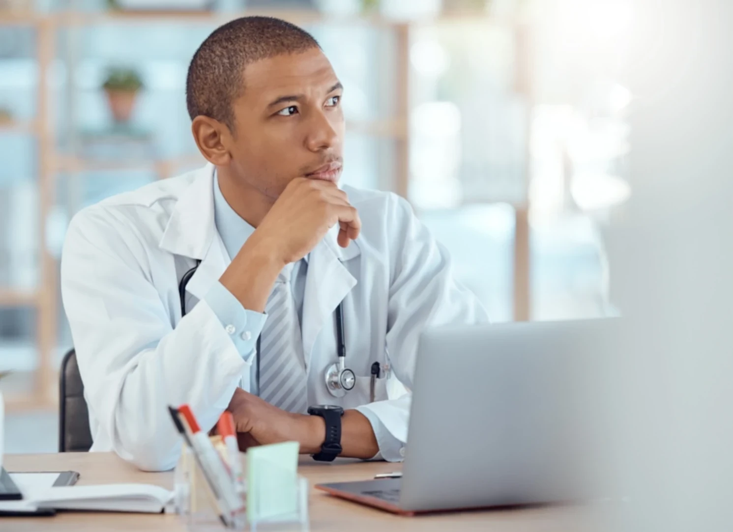 doctor thinking about marketing on a laptop