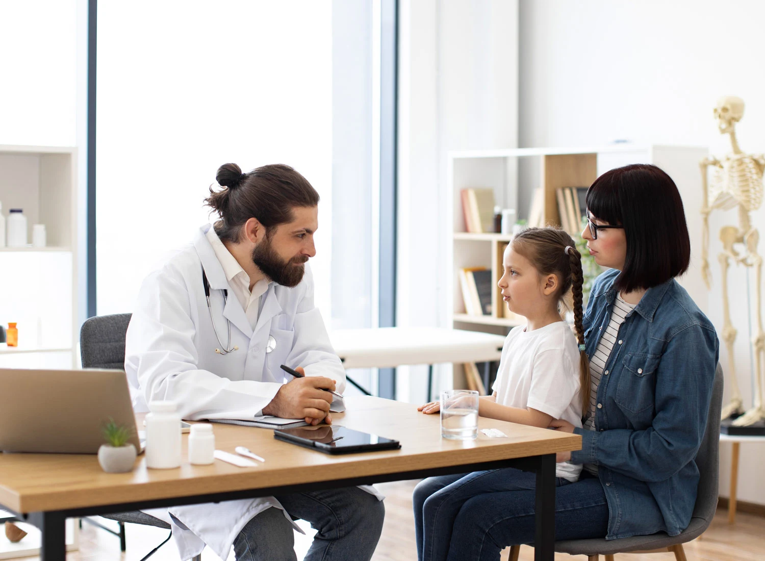 doctor with child and mother