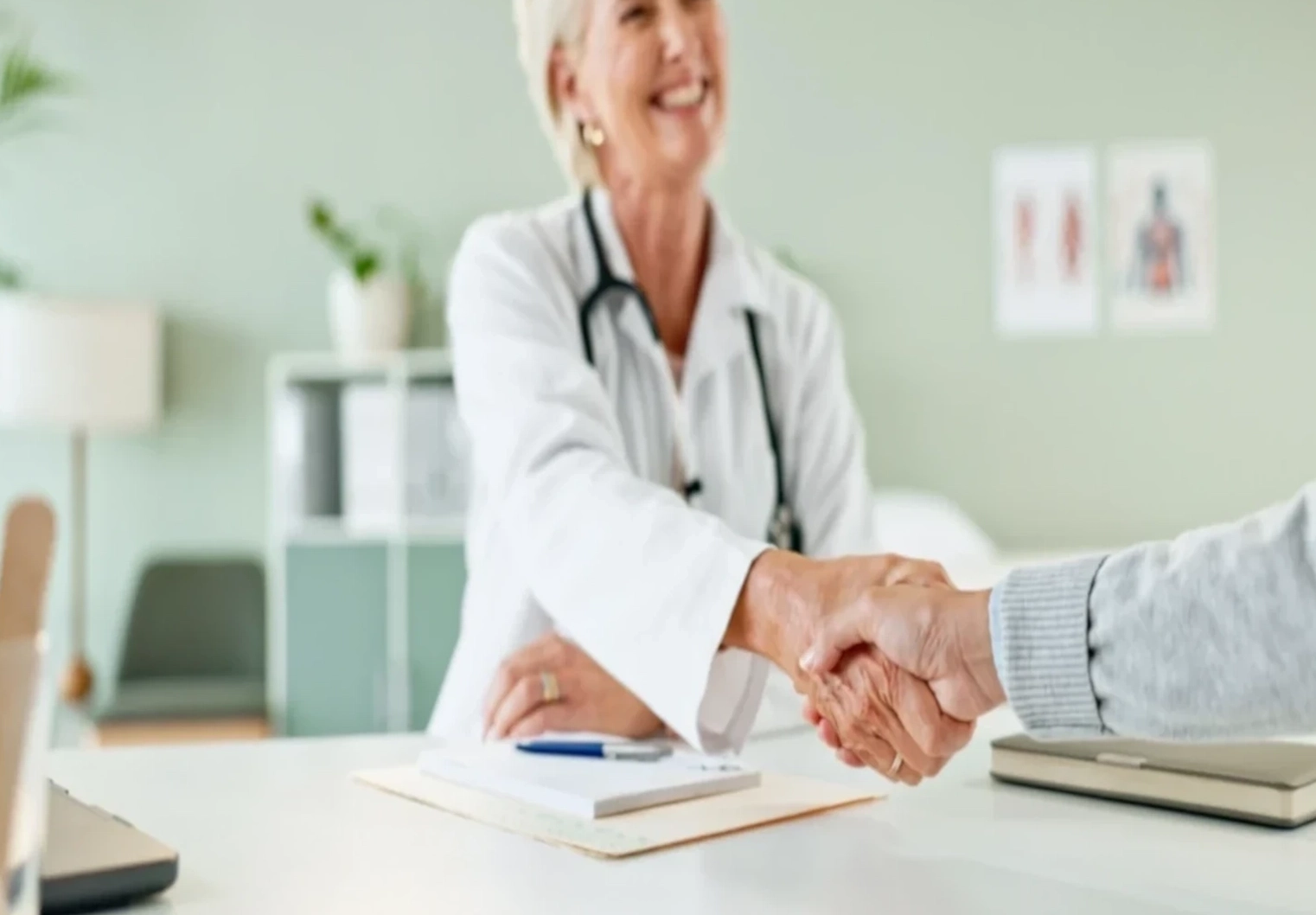 woman doctor shaking hands