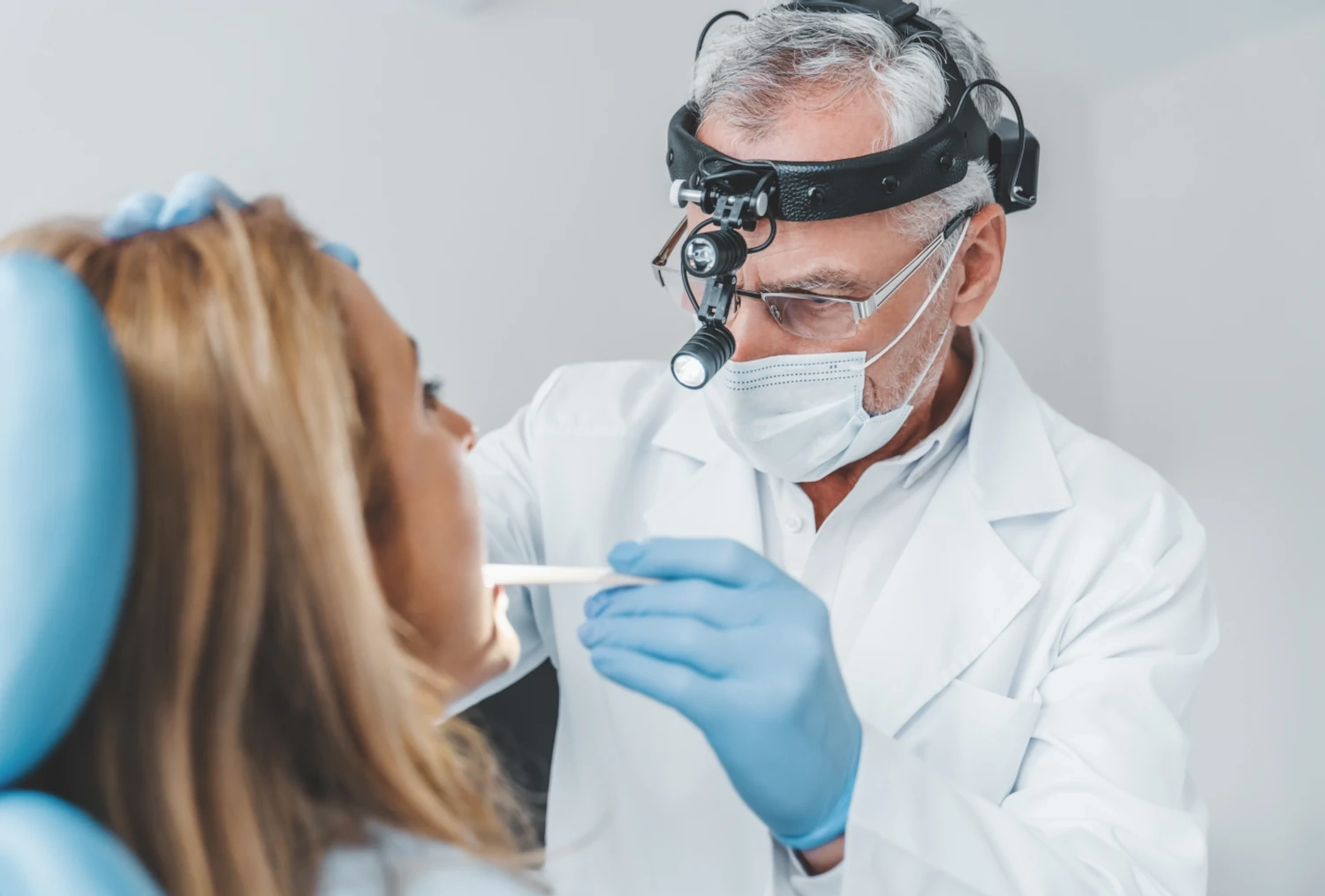 doctor checking nose and throat