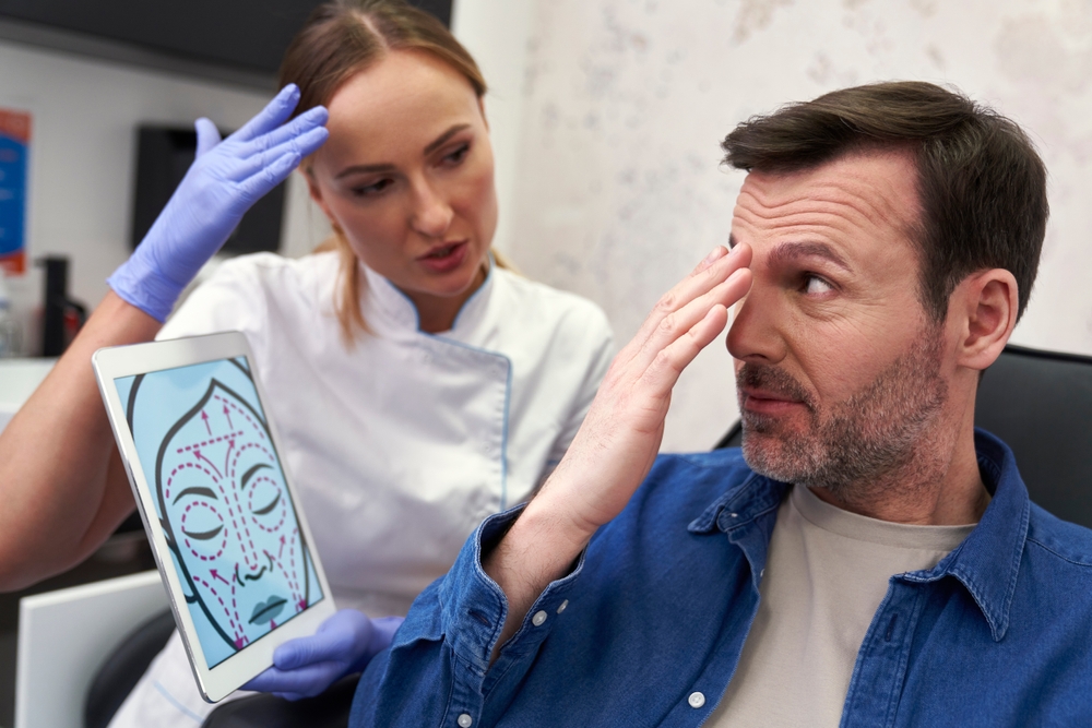 man getting an assessment of wrinkle by med spa technician