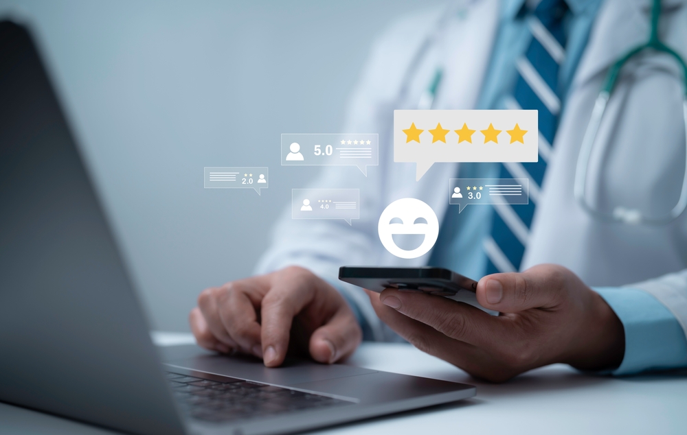 Doctor using smartphone and laptop with floating star rating icons representing online reviews, digital feedback management and patient satisfaction in modern healthcare services